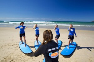 Go Ride A Wave Coolangatta students on boards on the beach